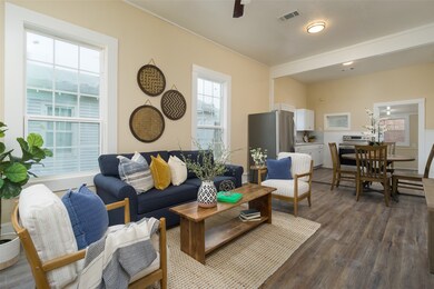 Open concept living, dining, kitchen.