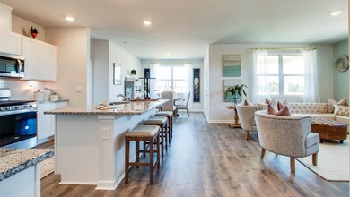 Kitchen with a center island with sink, wood-type 