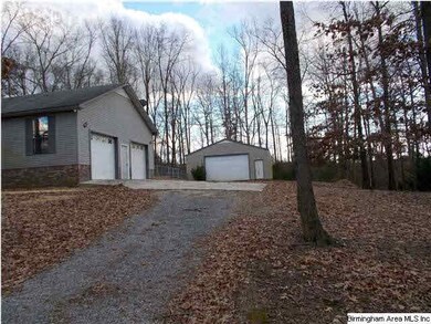 Home has circular drive and workshop