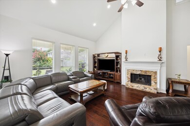 Spacious family room with dark engineered wood flo