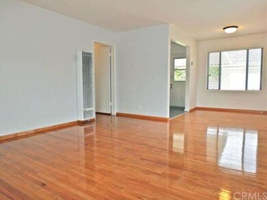 Living room and dining area with refinished hardwo