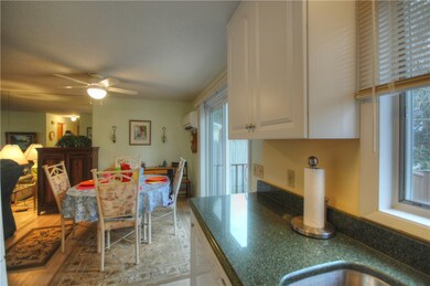 Newer Kitchen With Granite Counters and Ceiling He