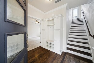 This inviting entryway features elegant hardwood f