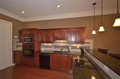 Updated kitchen with granite counters and new tile