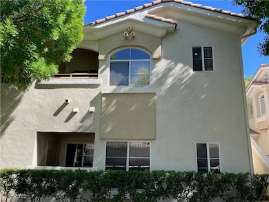 Rear view of property with visible vents and stucc
