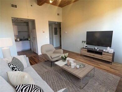 Virtually staged living room looking westward into