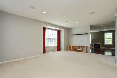 Living room with view into dining/kitchen.