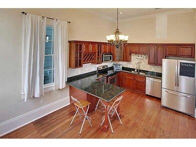 Kitchen. Lovely wood floors, thick crown molding a