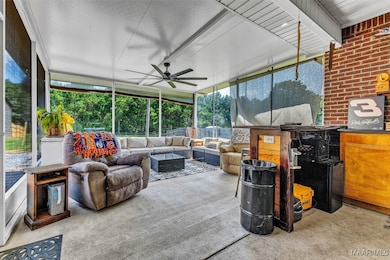 Screened back porch has built in bar with hot/cold