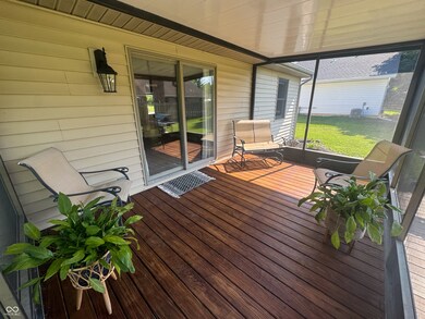 Outdoor lovers dream! Enjoy sipping coffee on this spacious covered and screen in porch.