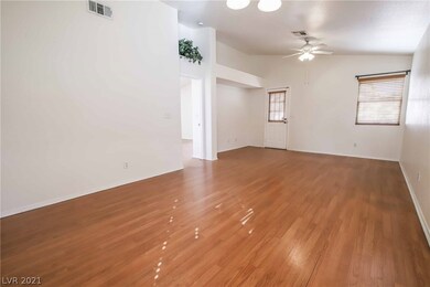 Spacious great room with vaulted ceilings and lami
