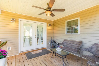 Deck with ceiling fan and french doors