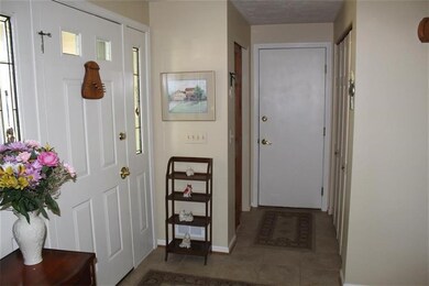 Foyer with access to Guest Closet, Garage, Laundry