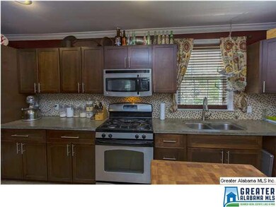 Cozy Kitchen with Mosaic Tile Backsplash, Tile Flo