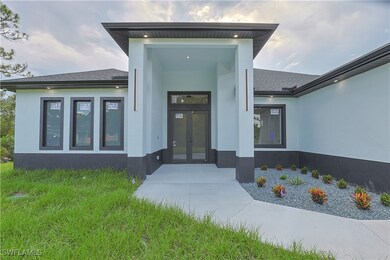 Entrance to property featuring stucco siding, fren