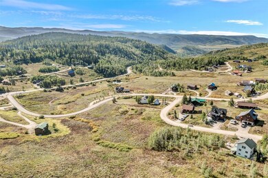 Birds eye view of property with a mountain view an