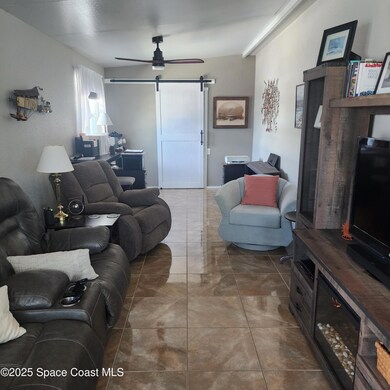 Living Room with Barn Door to Laundry