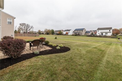 Open rear yard has access to neighborhood walking path and ample space.