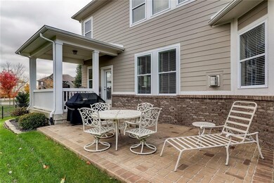Covered porch and stamped concrete patio, perfect space for entertaining! 