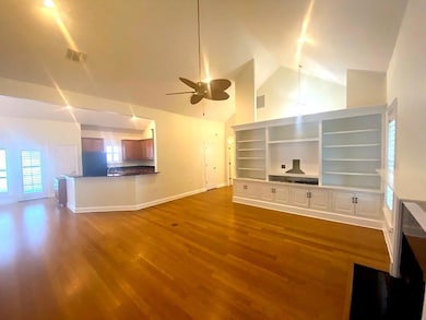 Gorgeous Bamboo flooring with vaulted ceiling living room