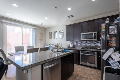 Kitchen with a sink, stainless steel appliances, v