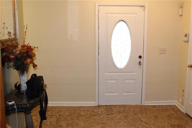 Foyer entrance featuring baseboards