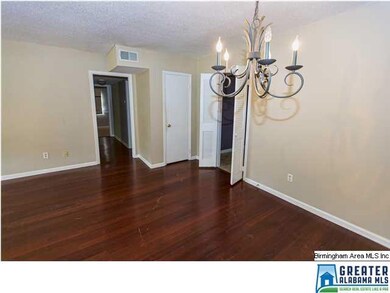 Nice, bright living/dining room with rich, hardwoo