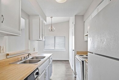 Kitchen with refrigerator, stove and dishwasher