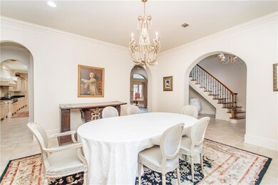 Formal dining is accessible to kitchen, living, bu