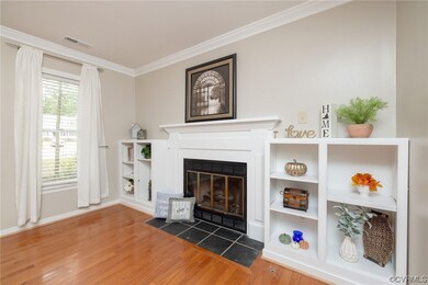 Living room featuring built-in cabinets around a g