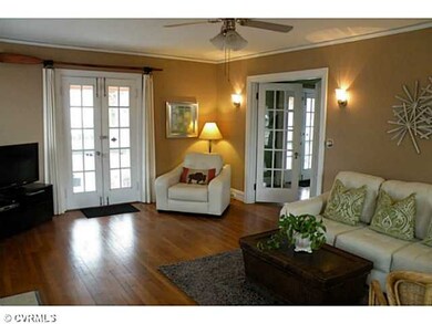 Living Room - French doors to side loggia and into dining room. Neutral and modern paint colors, gleaming wood floors and space to truly entertain!
