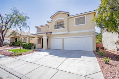 Traditional-style house with stucco siding, drivew