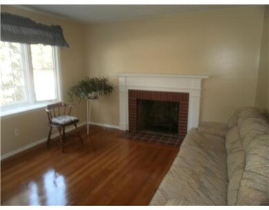Exterior Front. LIVING ROOM WITH GLEAMING HARDWOOD