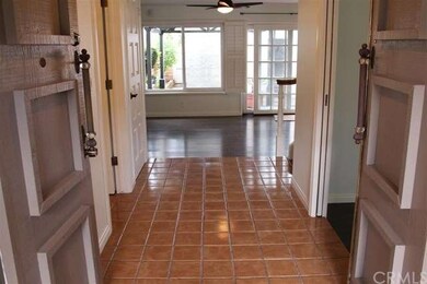 Double door entry with tile flooring.