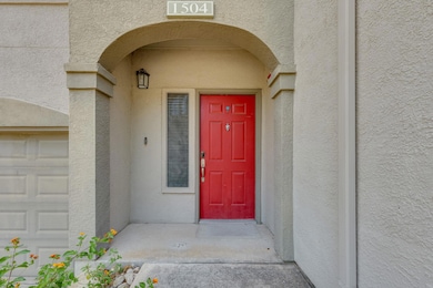 Property entrance featuring stucco siding