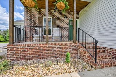 Doorway to property with brick siding