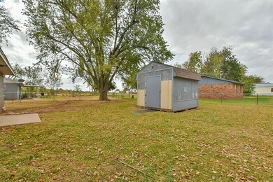 View of yard with a storage unit