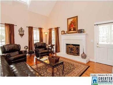 Vaulted ceiling, hardwood flooring and fireplace i