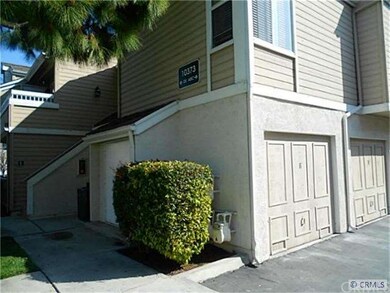 Garage next to stairway of condo unit.