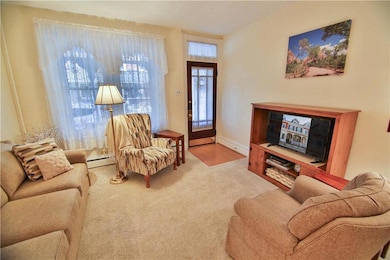 View of living room to front door