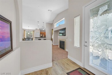 Enter into Great Room w/High Vaulted Ceilings for