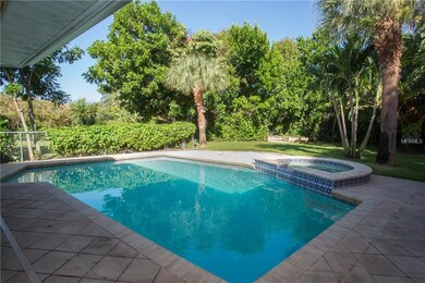 Gorgeous pavered pool with spill over hot tub. Bab