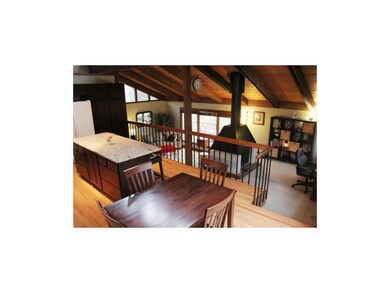 Huge kitchen overlooks dramatic living room and di