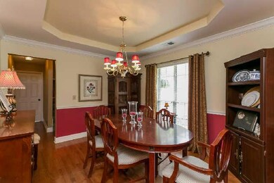 As you enter the foyer, the beautiful dining room is just to the right and just steps away from the kitchen.
