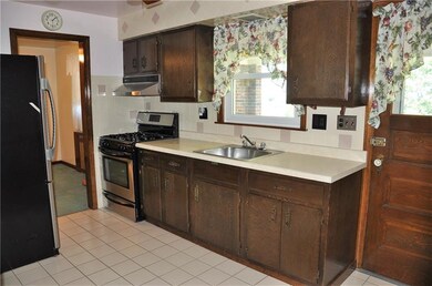 Kitchen, with stainless steel appliances and door 