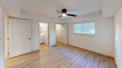 Unfurnished bedroom with light wood finished floor