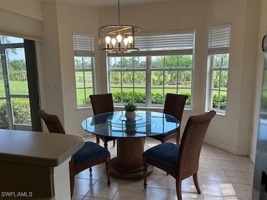 Dining space with baseboards, light tile patterned