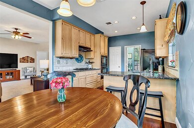 Breakfast room and kitchen area. Conveniently located near the living room.