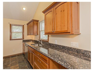 Beautiful updated kitchen with cherry cabinets and