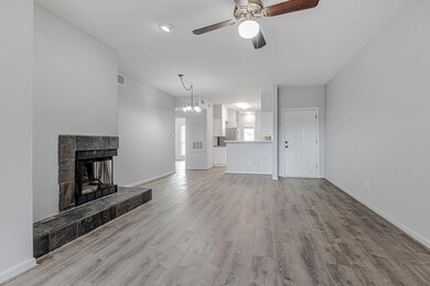 Unfurnished living room with wood finished floors